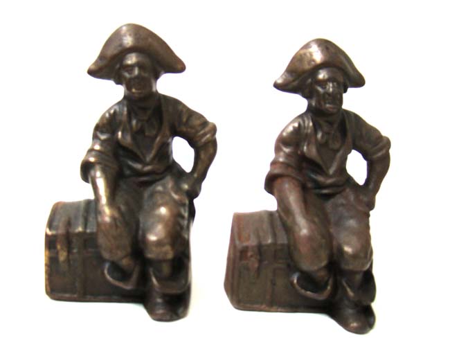 A pair of antique Bookends depicting a Pirate sitting on a Treasure chest circa 1900